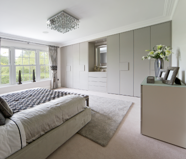 Modern bedroom with minimalist fitted wardrobes