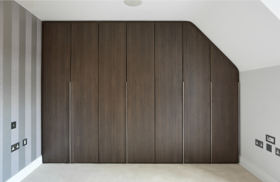 Fitted wardrobes with sleek chrome handles